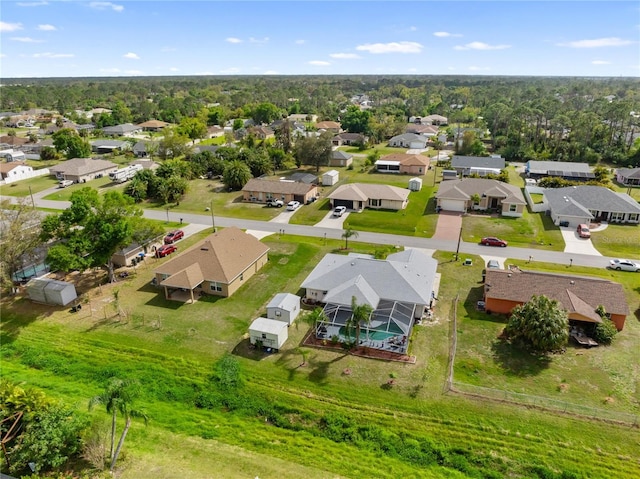 birds eye view of property with a residential view