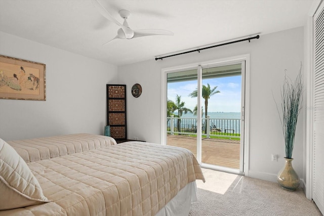 bedroom featuring ceiling fan, access to exterior, and carpet flooring