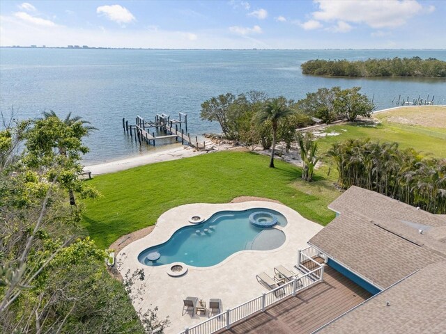 view of pool with boat lift, a yard, a water view, and a boat dock