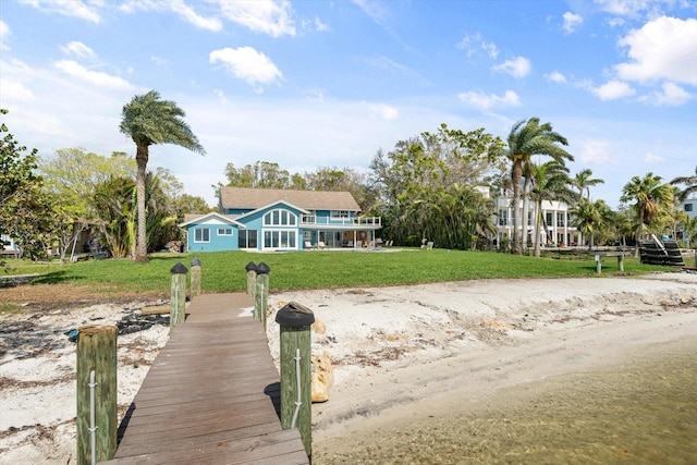 dock area featuring a lawn