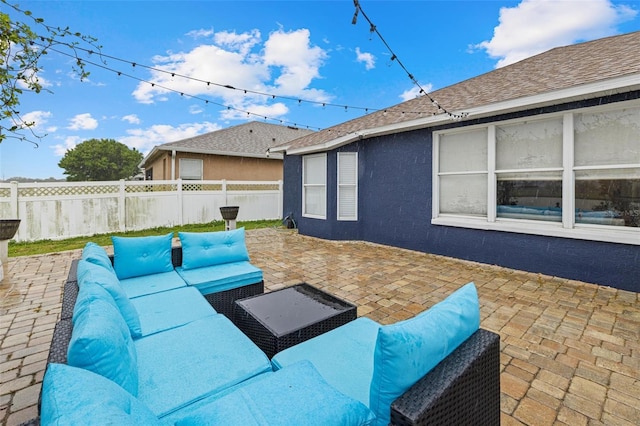 view of patio with fence and an outdoor hangout area