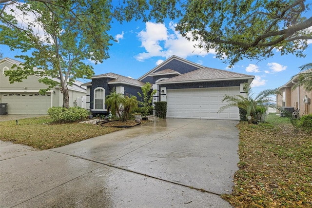 ranch-style house with stucco siding, driveway, and an attached garage