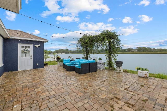 view of patio / terrace with outdoor lounge area and a water view