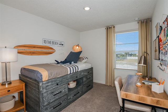 carpeted bedroom with a textured ceiling