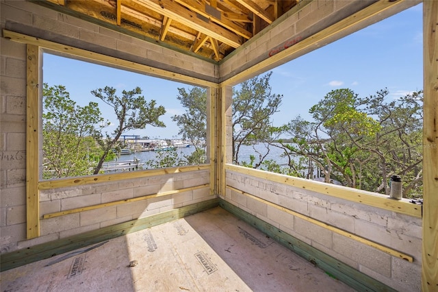 view of patio / terrace featuring a water view and a balcony