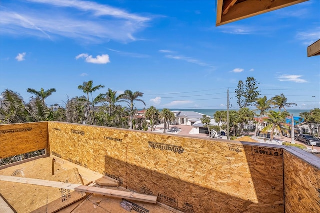 exterior space with a balcony and a water view