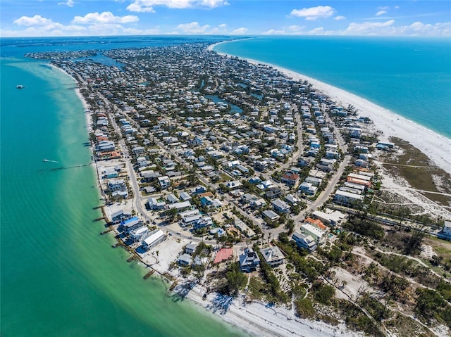 drone / aerial view featuring a view of the beach and a water view