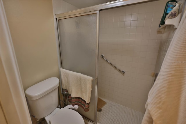 full bathroom with toilet and a shower stall