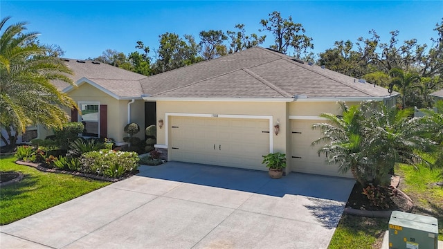 view of front of property featuring stucco siding, concrete driveway, an attached garage, and a shingled roof