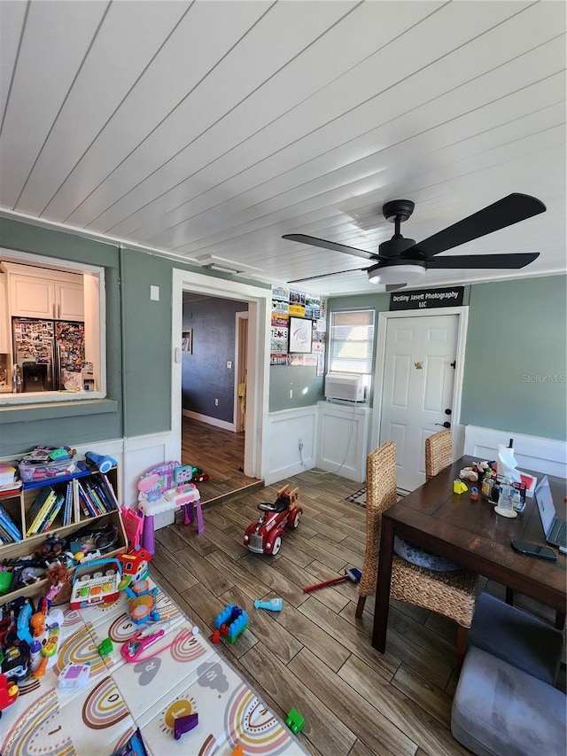 interior space featuring wood ceiling, a ceiling fan, and wood finished floors