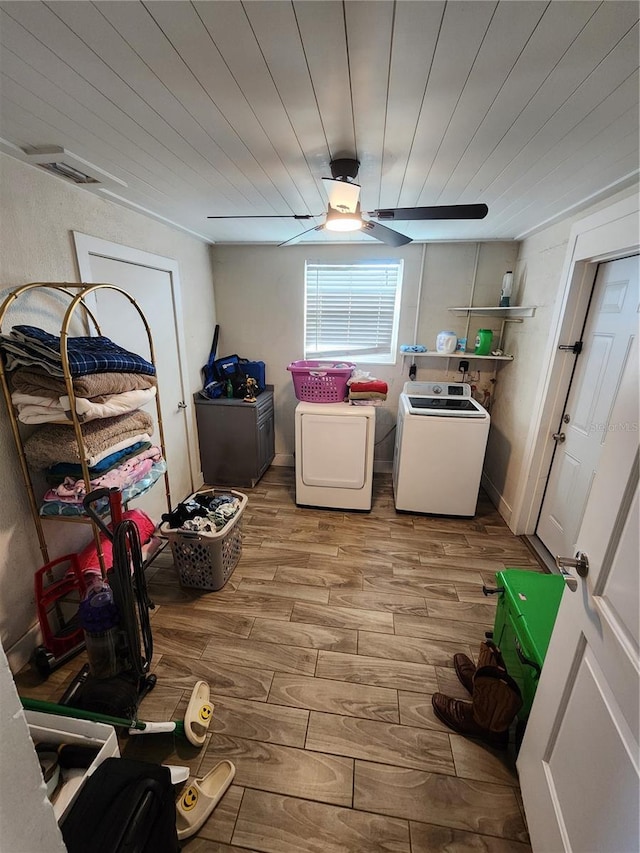 washroom with wood finished floors, laundry area, ceiling fan, washer and dryer, and wooden ceiling