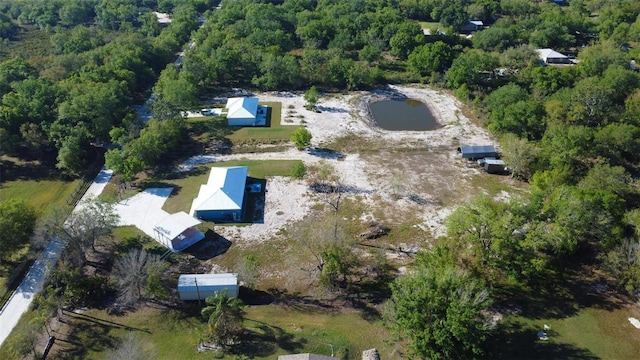 bird's eye view featuring a wooded view