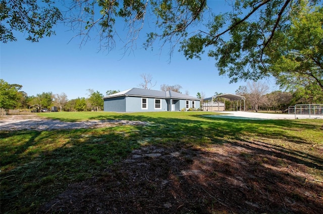 view of yard with a carport