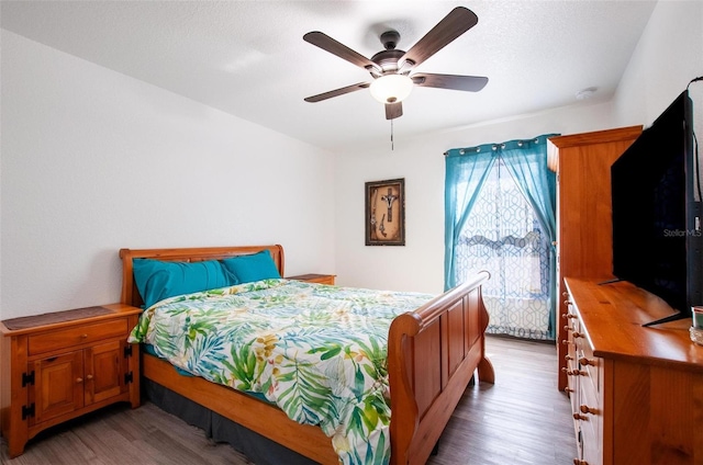 bedroom featuring ceiling fan and wood finished floors