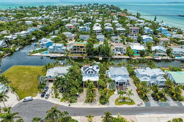 516 Kumquat Dr, Anna Maria, FL 34216 - aerial perspective of suburban area with a large body of water