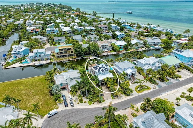 516 Kumquat Dr, Anna Maria, FL 34216 - aerial view of residential area with a large body of water