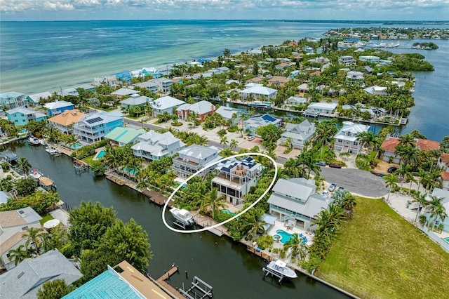 516 Kumquat Dr, Anna Maria, FL 34216 - aerial view of residential area with a large body of water
