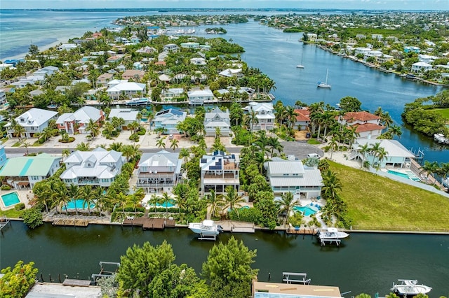 516 Kumquat Dr, Anna Maria, FL 34216 - aerial view of residential area with a nearby body of water