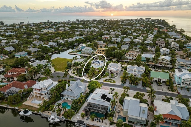 516 Kumquat Dr, Anna Maria, FL 34216 - aerial view of residential area with a large body of water