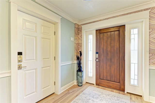 516 Kumquat Dr, Anna Maria, FL 34216 - entryway with light wood finished floors and baseboards