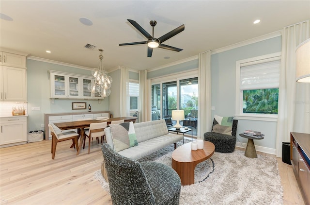 516 Kumquat Dr, Anna Maria, FL 34216 - living room featuring crown molding, light wood-style floors, ceiling fan, and recessed lighting