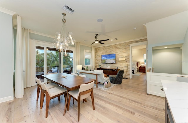 516 Kumquat Dr, Anna Maria, FL 34216 - dining room featuring crown molding, light wood-style floors, ceiling fan, a chandelier, and recessed lighting