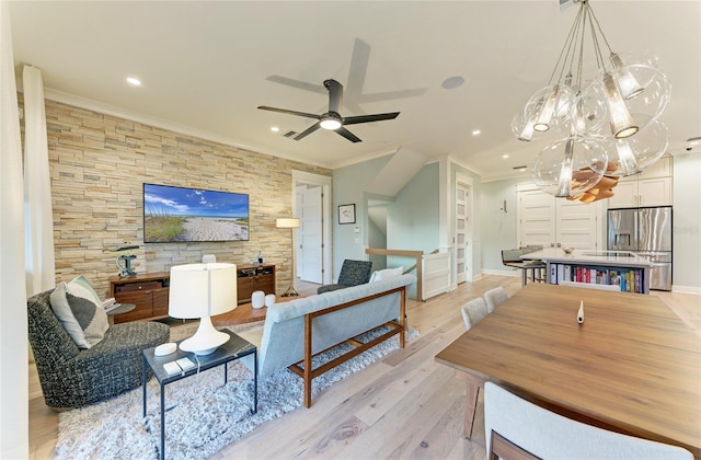 516 Kumquat Dr, Anna Maria, FL 34216 - living area featuring light wood-style floors, a ceiling fan, a chandelier, crown molding, and recessed lighting