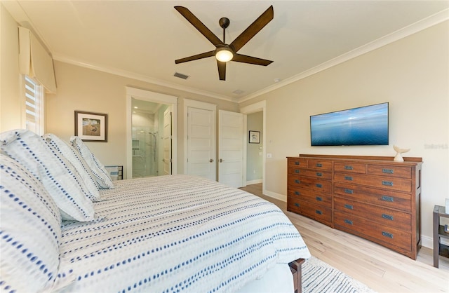 516 Kumquat Dr, Anna Maria, FL 34216 - bedroom with light wood finished floors, ornamental molding, ensuite bath, and ceiling fan