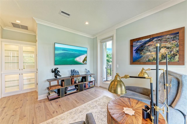 516 Kumquat Dr, Anna Maria, FL 34216 - living area featuring ornamental molding, light wood-style floors, and recessed lighting