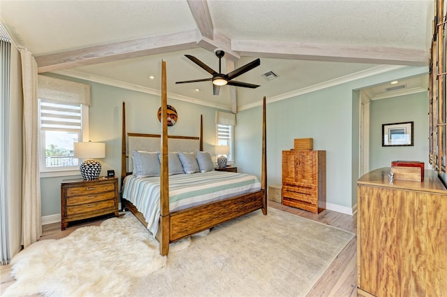 516 Kumquat Dr, Anna Maria, FL 34216 - bedroom with wood finished floors, multiple windows, a ceiling fan, a textured ceiling, and crown molding