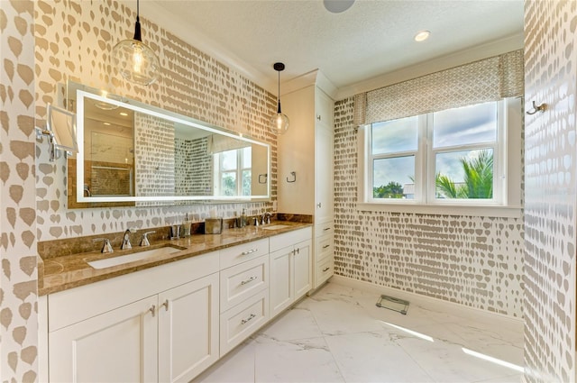 516 Kumquat Dr, Anna Maria, FL 34216 - bathroom featuring wallpapered walls, double vanity, marble look tiles, a shower, and a textured ceiling