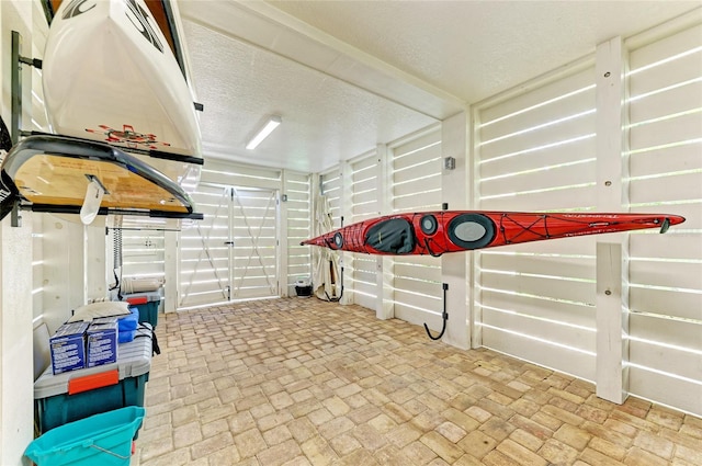 516 Kumquat Dr, Anna Maria, FL 34216 - misc room with brick flooring