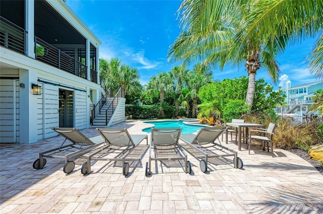 516 Kumquat Dr, Anna Maria, FL 34216 - view of patio / terrace featuring stairway