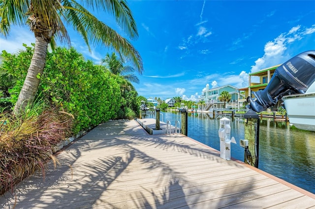 516 Kumquat Dr, Anna Maria, FL 34216 - dock area featuring a water view