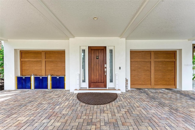 516 Kumquat Dr, Anna Maria, FL 34216 - view of exterior entry with stucco siding