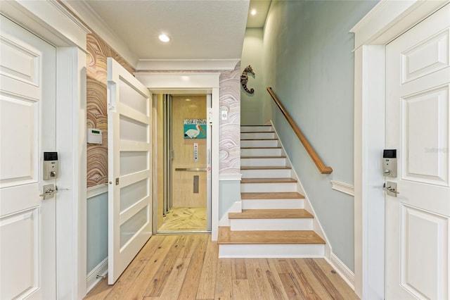 516 Kumquat Dr, Anna Maria, FL 34216 - stairway with wood finished floors and recessed lighting