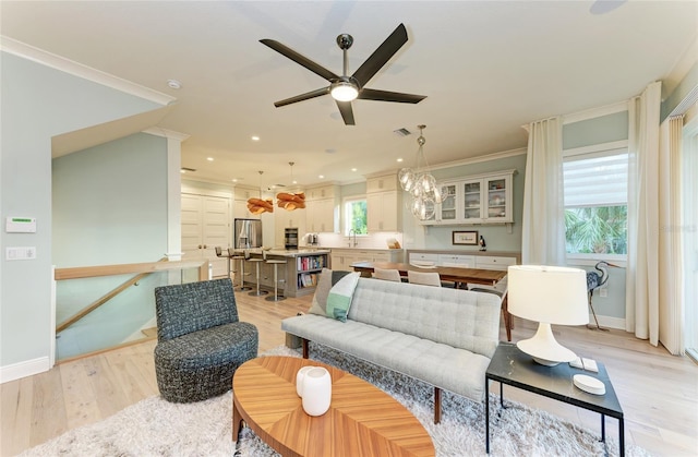 516 Kumquat Dr, Anna Maria, FL 34216 - living area with ceiling fan, plenty of natural light, light wood-type flooring, ornamental molding, and recessed lighting