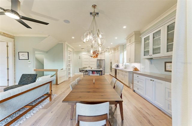 516 Kumquat Dr, Anna Maria, FL 34216 - dining area featuring ornamental molding, ceiling fan, recessed lighting, a chandelier, and light wood-style flooring