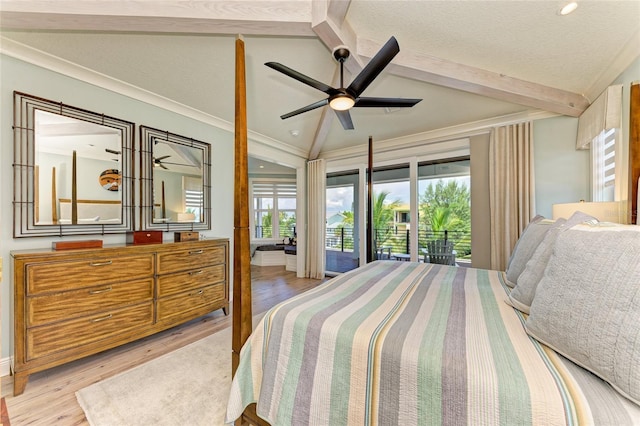 516 Kumquat Dr, Anna Maria, FL 34216 - bedroom featuring light wood-style flooring, access to exterior, a ceiling fan, and a textured ceiling