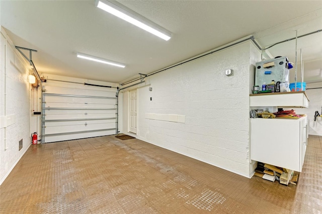 516 Kumquat Dr, Anna Maria, FL 34216 - garage with concrete block wall