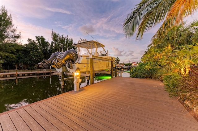 516 Kumquat Dr, Anna Maria, FL 34216 - dock area featuring boat lift and a water view
