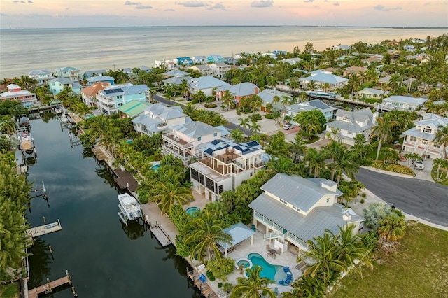 516 Kumquat Dr, Anna Maria, FL 34216 - aerial perspective of suburban area with a nearby body of water and a pool