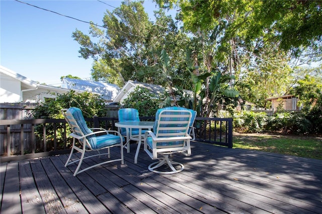 deck with fence and outdoor dining space