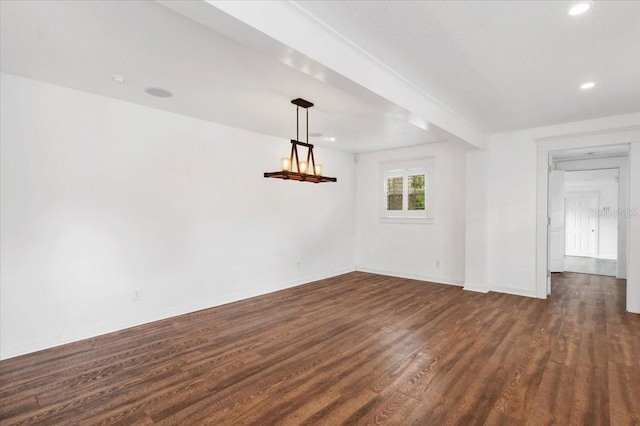 unfurnished room with dark wood finished floors, recessed lighting, and baseboards