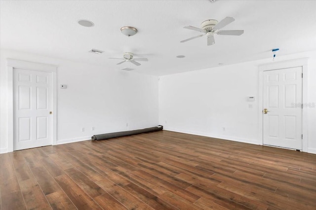 spare room with visible vents, baseboards, ceiling fan, and wood finished floors