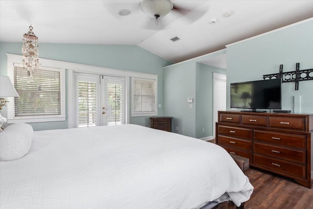 bedroom with visible vents, dark wood-style flooring, vaulted ceiling, french doors, and access to outside