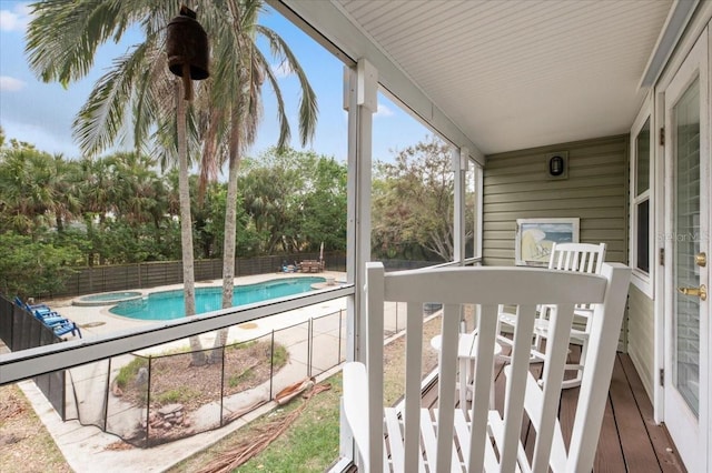 exterior space with a pool with connected hot tub