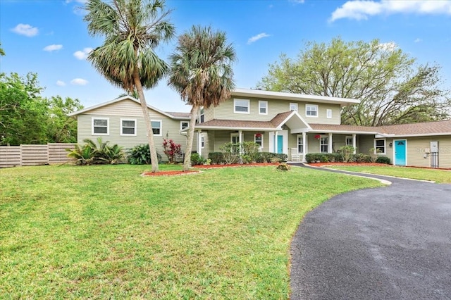 view of front of house featuring a front yard and fence