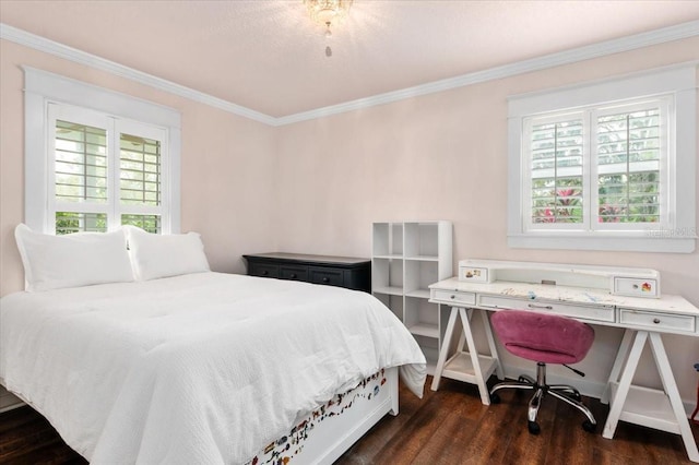 bedroom with dark wood-type flooring, multiple windows, and ornamental molding