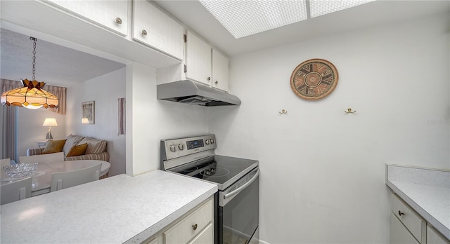 kitchen with light countertops, electric range, white cabinetry, and under cabinet range hood